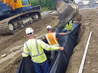 Installing French Drain at Abutment 2 MSE Wall of Lambert Road Bridge